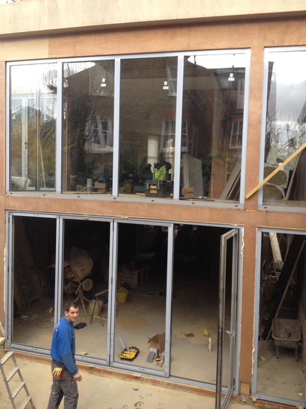 Aluminium bi-fold doors with two-storey glazing in Plumstead
