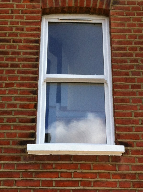 uPVC sash window on Victorian red brick house in Plumstead